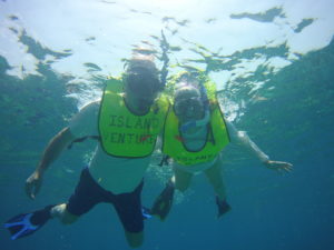 snorkelers in the water who have learnt how to snorkel with Island Ventures